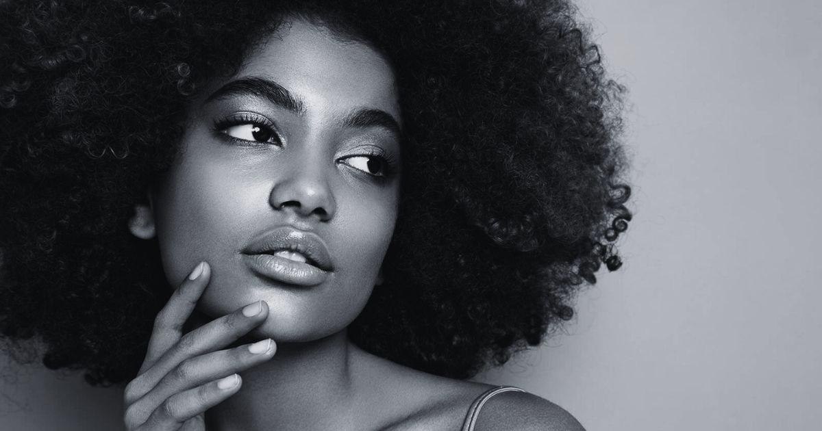 Blog 9 A curly-haired woman with perfectly shaped lips.