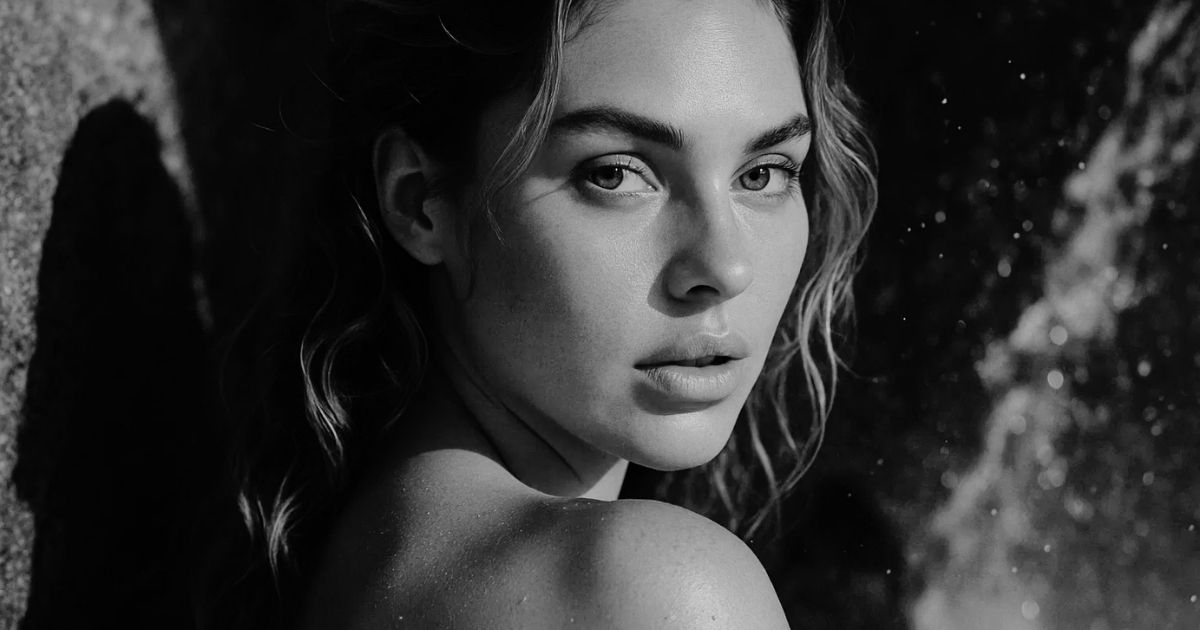 Blog 5 Close-up portrait of a woman with glowing skin in warm natural light.